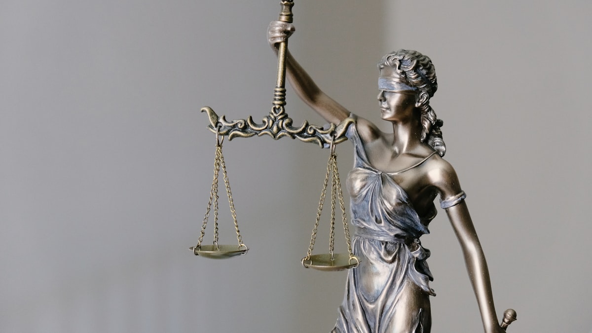 Legal gavel and statute book on a desk